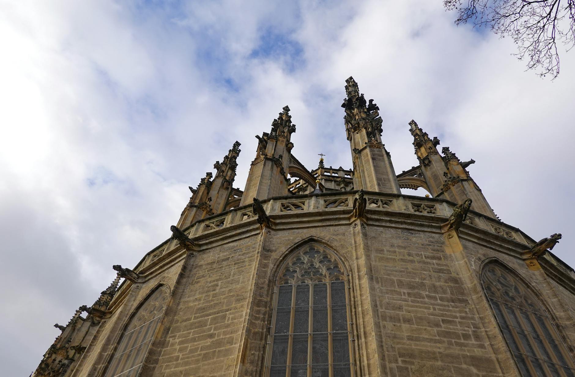 Stunning low-angle view of Gothic architecture at St. Barbara's Church in Kutná Hora, Czech Republic.