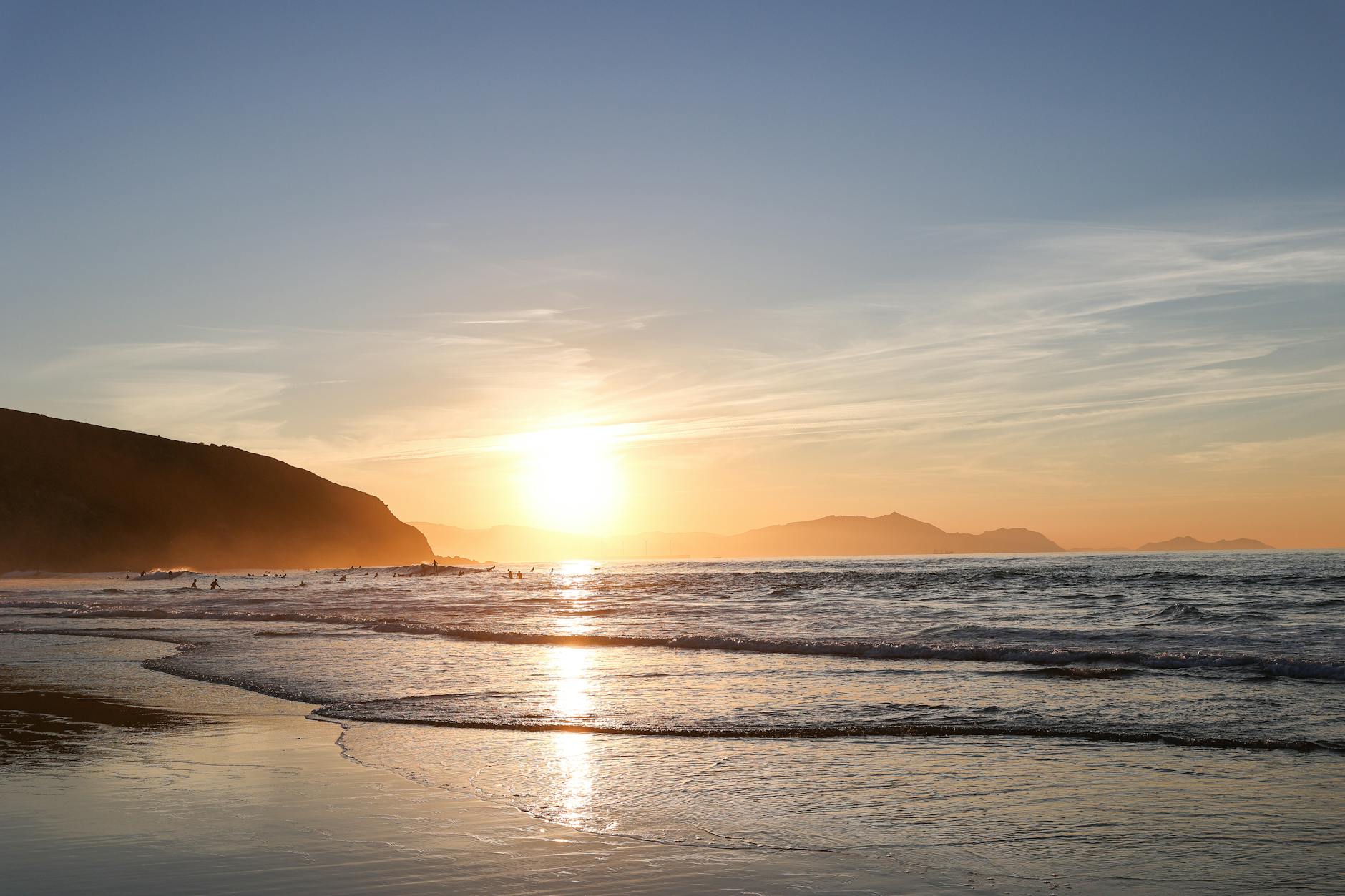 Stunning sunset view at a beach in País Vasco, Spain, capturing the serene ocean and vibrant colors.